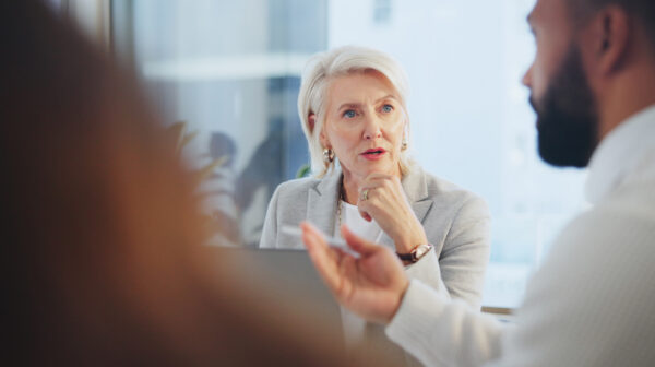 Woman maintaining mediator neutrality during a difficult conversation